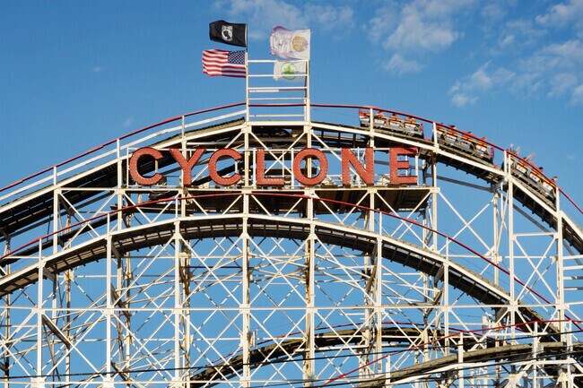 The historic Cyclone roller coaster dominates Coney Island's skyline.