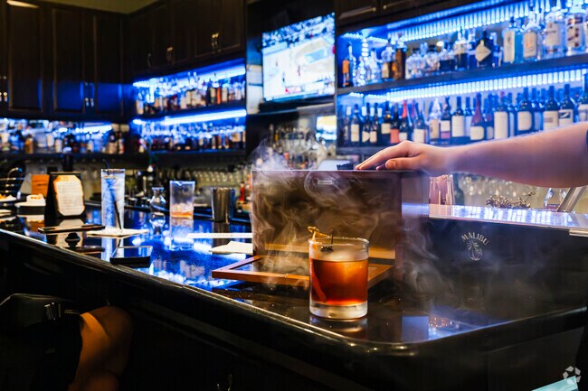 Enjoy a smoked old fashion cocktail at Malibu Beach Grill in the Pavilion by Broken Bow Estates.