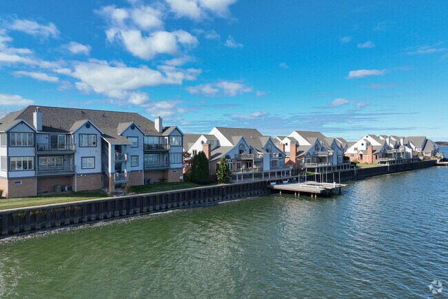 Niagara Point Drive homes overlook Presque Isle Bay and sunset skies.
