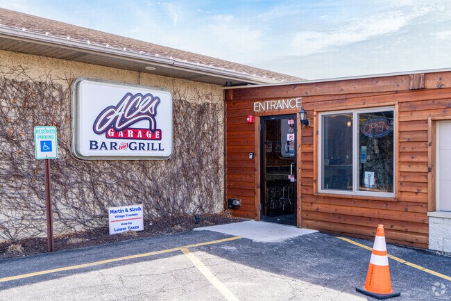 ACES GARAGE Bat & Grill is known for their burgers & vintage cars.