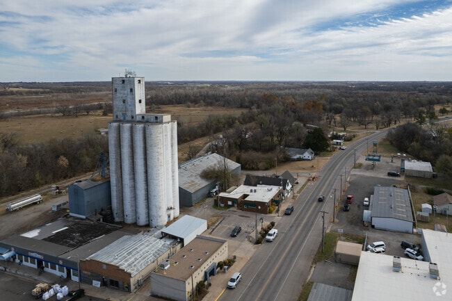 A large grain silo sits on Main Street in Harrah.