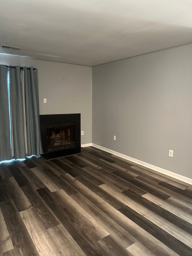 Living room with wood-burning fireplace