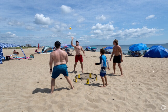 Folks soak up the sun and sand in Bay View.