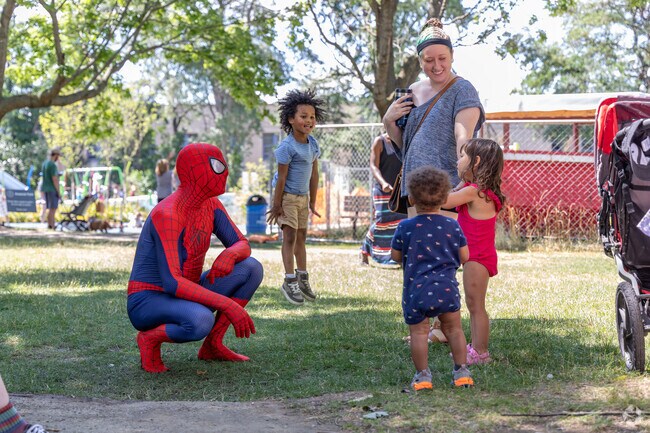 Kids jumping with joy at the Lawrenceville Independence Day Celebration.