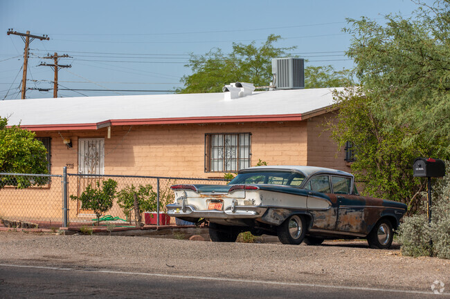 A vintage car sits in a Mountain First Avenue front yard.