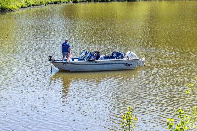 A couple from Bent Tree gathers bait fish on Oak Hollow Lake.