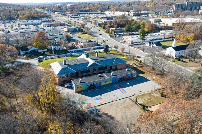 There is a train mural on the backside of Lincoln Street School by the playground.