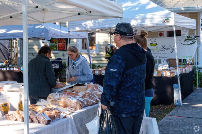 At the weekly farmers market, an Oviedo resident selects fresh bread.