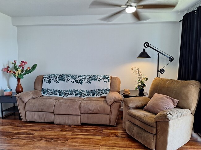 Comfortable living room facing large screen television