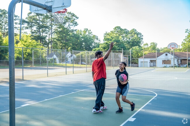 Play ball with a friend at Rezolle Reynolds Park near Central Park.