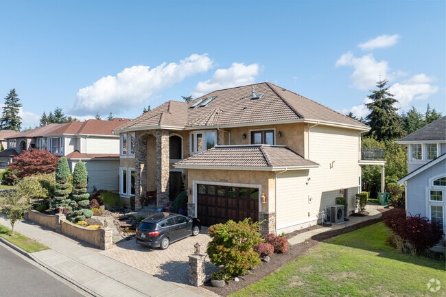 New Traditional homes atop the hills in Adelaide offer views of the Puget Sound and mountains.