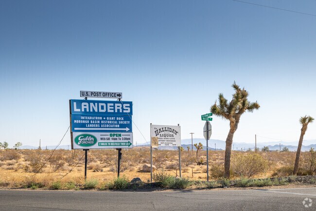 Roadside sign welcoming residents to the desert town on Landers.