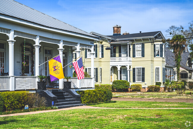 A home in Washington Square proudly displays multiple flags.