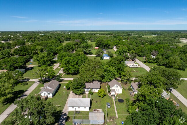 Homes in Chanute are often surrounded by tall trees.