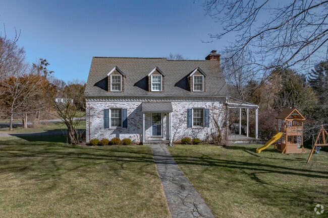 A cute and cozy washed brick home on West Pl in eastern Chappaqua.