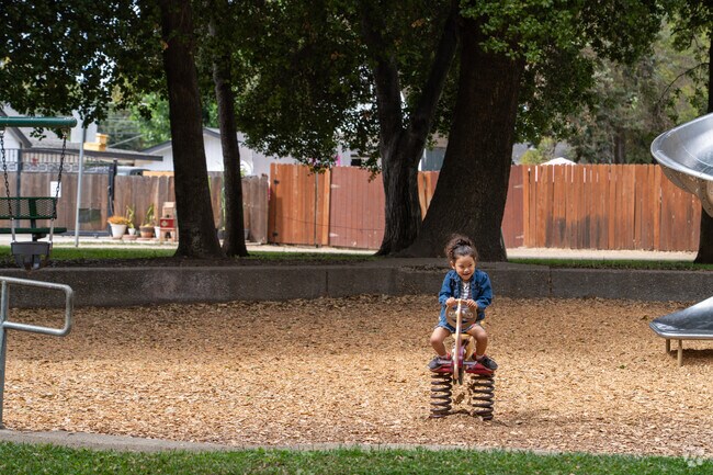 A child plays on the playground at Woodbridge Community Park.