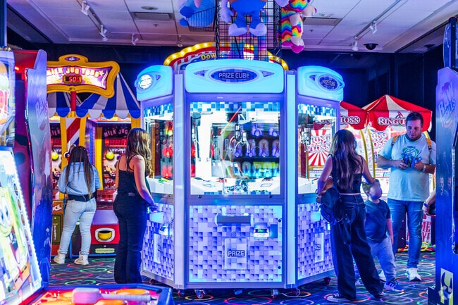 Play arcade games at Coral Square Mall near Boulevard Woods North, Lauderhill, Florida.