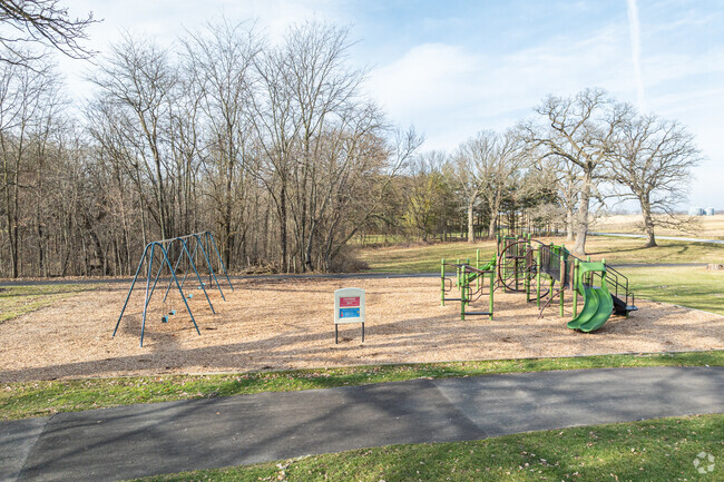The playground at Nettle Creek Elementary School has a swing-set, slides & climbing structures.