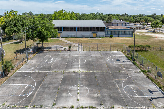 Students play basketball on the outdoor courts at Lincoln Middle School.