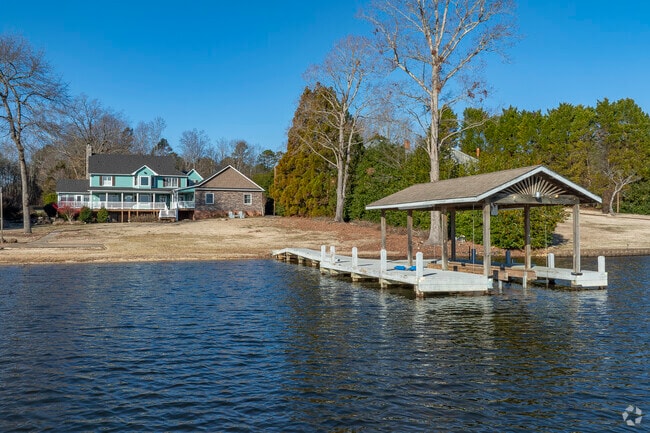 Shelby home owners on Lake Moss enjoy private docks and lake access.