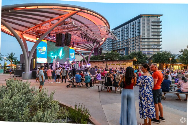 Many locals enjoy the time outdoors at Sounds of Summer on The Stage at Grandscape.