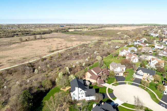Locals can hike over five miles of trails in 1,000-acre Hawk Hollow Forest Preserve.