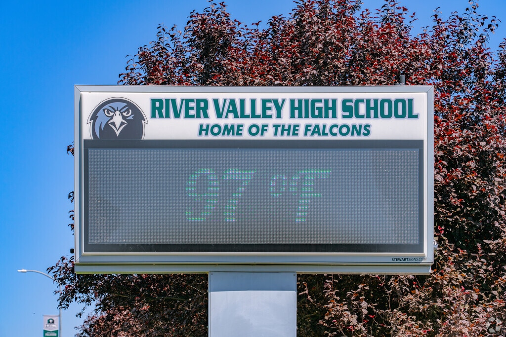 Important information is displayed at the River Valley High School sign.
