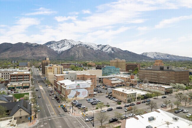 A cityscape against majestic mountains in downtown Ogden.