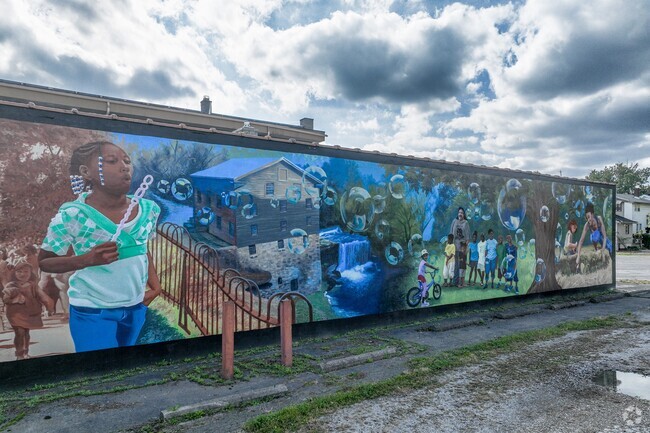 Multiple murals appear around Idora.