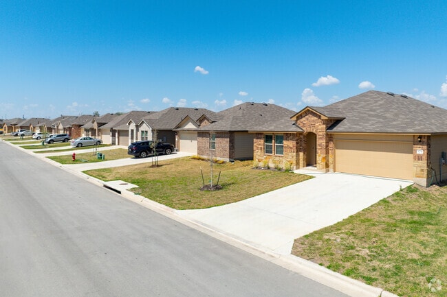 Single-story brick homes and wide streets are common in Sonterra.