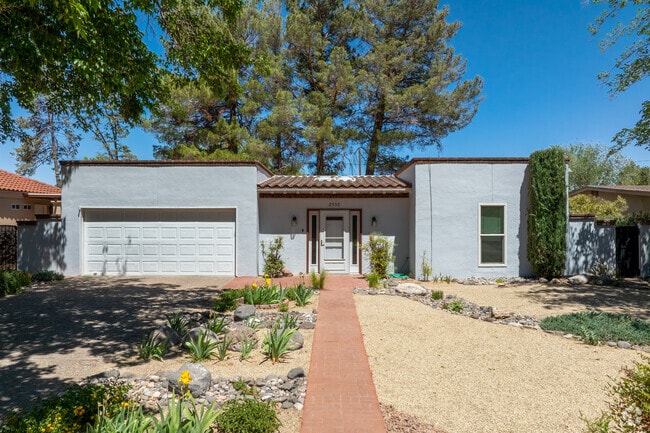 Mesilla Park showcases bold curves and clay tiles in classic Southwestern style.