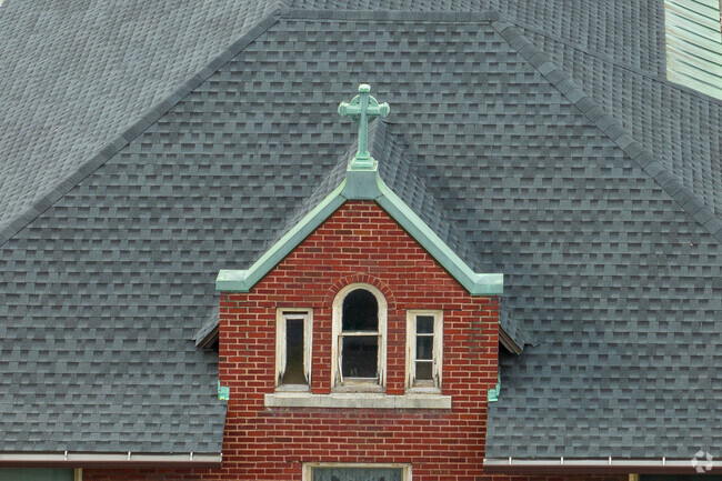 Immaculate Conception School is adorned with Catholic symbols.
