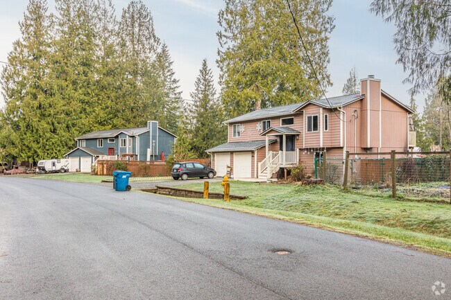 Most of the streets and houses in the  Riverbend neighborhood are shaded by tall trees.