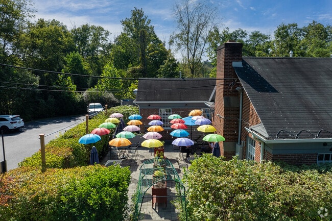 Colorful umbrellas welcome diners to Clinton's outdoor eateries, like the Juniper Hill Restaurant and Bar.