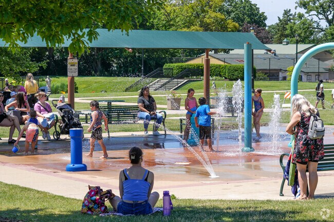 Residents of Southeast Aurora enjoy the splash pad at the Phillips Park Aquatic Center.