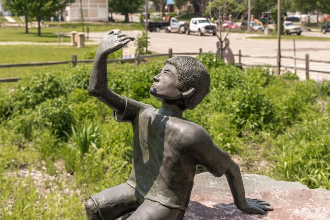 A bronze sculpture of a child adorns the Boys & Girls Club garden in the Roosevelt-Phalen Center neighborhood.