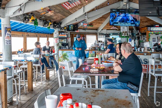 Enjoy food and drinks at BARge 295, a waterfront eatery located a short drive from Seabrook.
