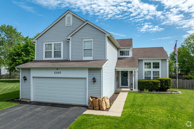 West Sanctuary Lane features many newer traditional homes with attached garages.
