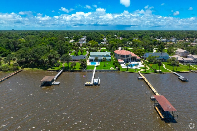 Many Woodmere homes boast private pools and docks along the Halifax River.