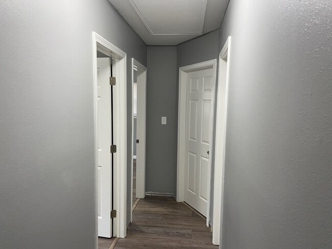 Hallway to 2 extra bedrooms and Master