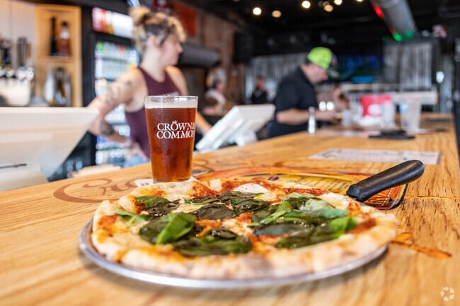 Joannes Park residents grab delicious pizza and cold beer at Crown & Common.