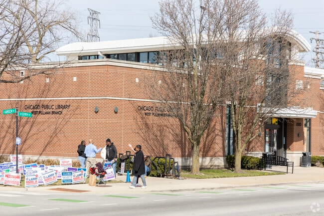 At the West Pullman Library, residents line up to demonstrate political support.