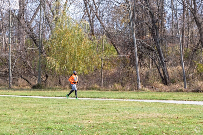 A man goes for a run on a path in Schreiber Park.
