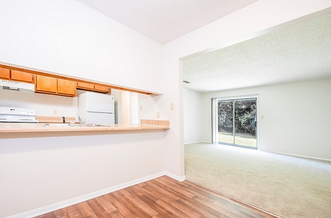 Experience the blend of style and comfort in this open-concept living area.