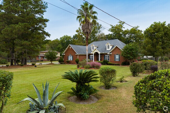 Newly constructed homes feature shaded lots and coastal landscaping.