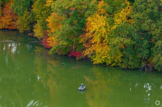 Residents cast lines at Spectacle Pond in the quiet Spectacle neighborhood near Providence.