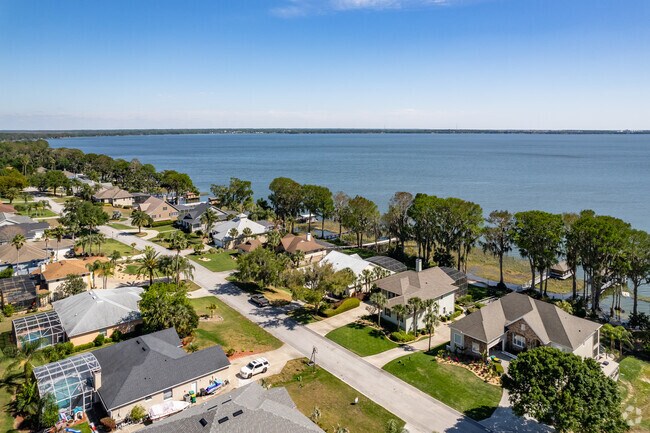 Ariel view of large waterfront homes on Lake Eustis in Grand Island's Bright Water community.