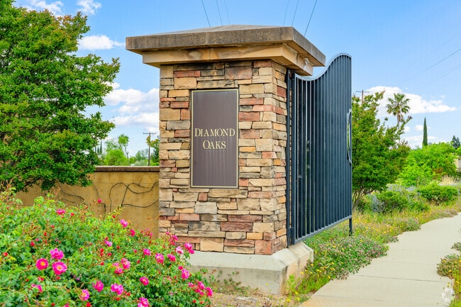 Large gates with signage welcome residents to Diamond Oaks Neighborhood.