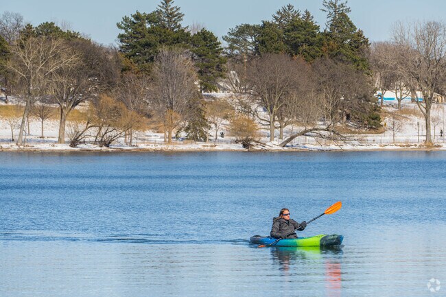An adventurous kayaker enjoys Lake Nokomis which is near the Page neighborhood.