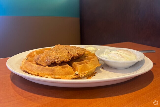 Fried chicken and waffles with eggs is a must try at Cromwell Diner.
